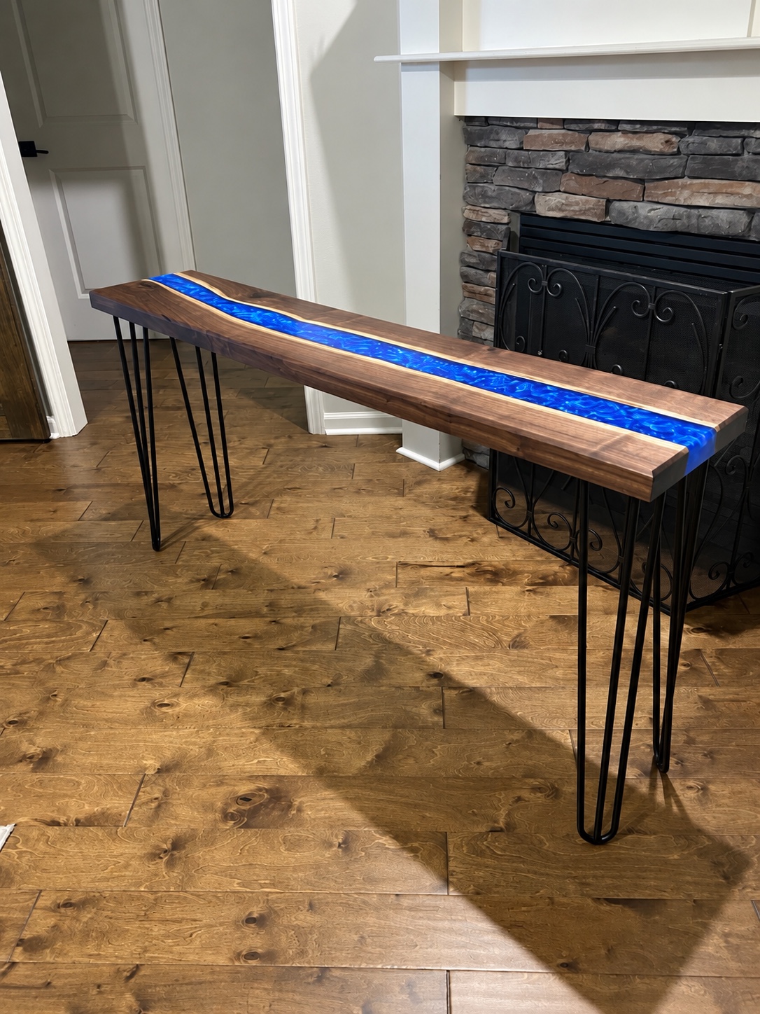 Client reference photograph showing the overall walnut river table concept